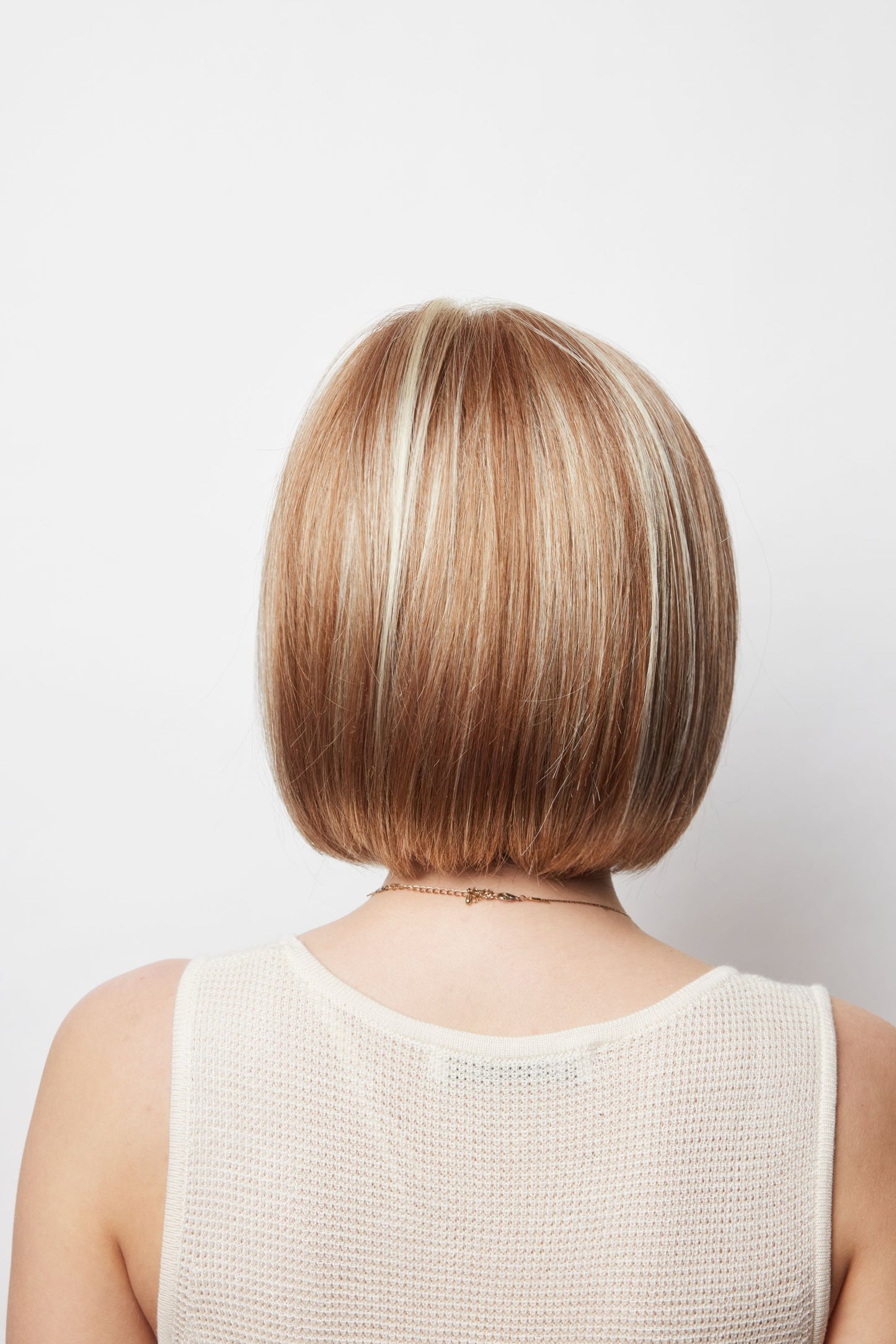 Erika Wig by Amore – Sleek Medium-Length Bob | Monofilament Top | Synthetic Fibre