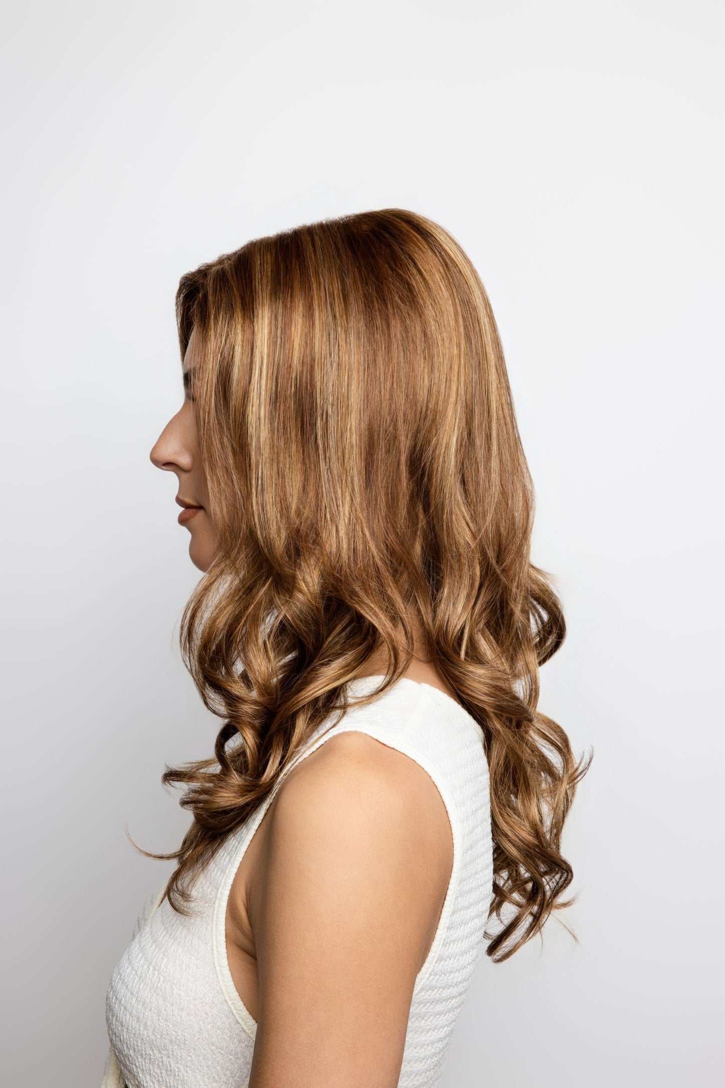 Brittany Wig by Amore – Long Curly Wig with Layers & Monofilament Top